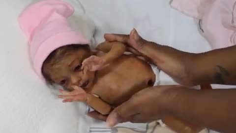 preemie doll gets dressed