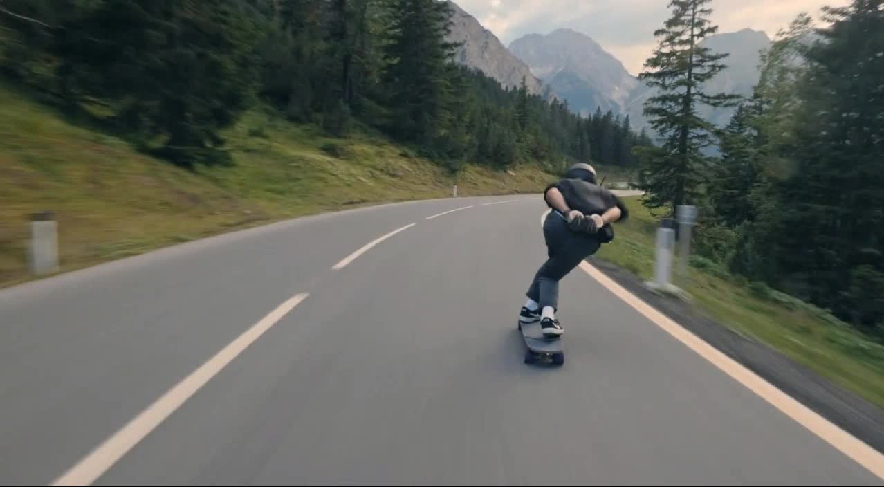 Long board downhill across the Austrian Alps.