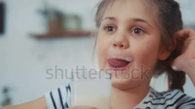 little girl child drinking milk