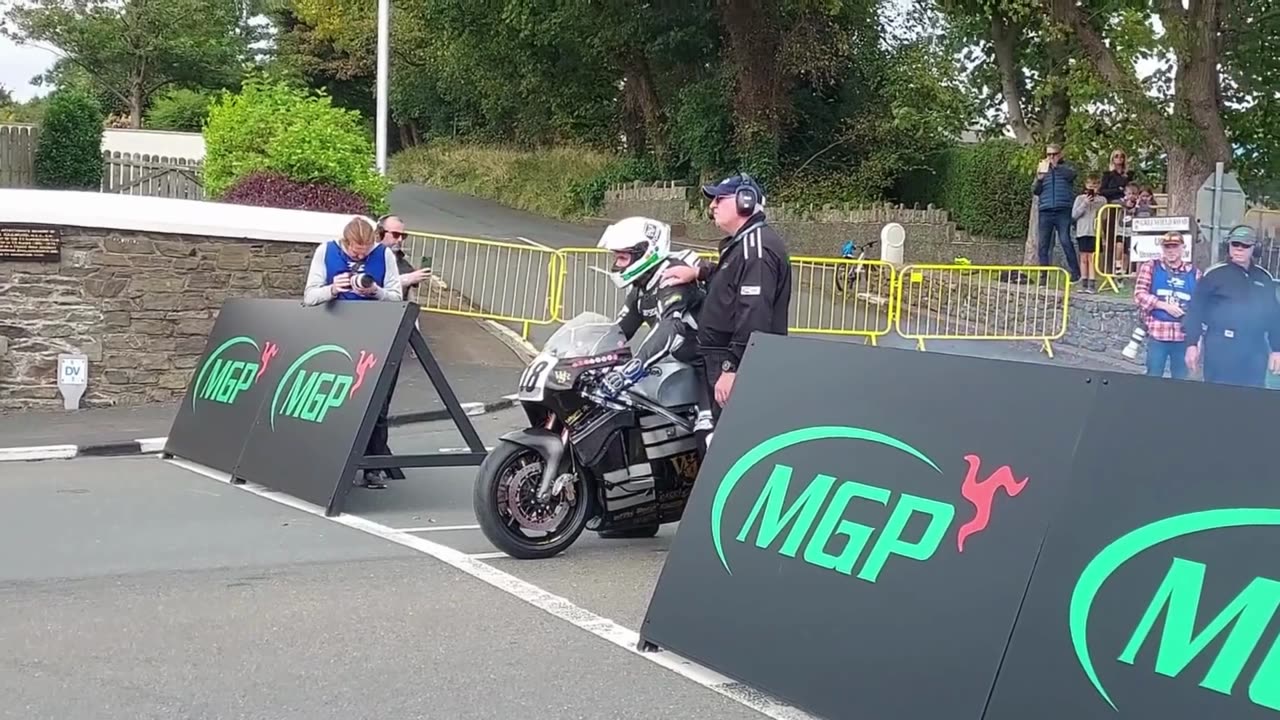 motorcycle racing through city streets TT IOM