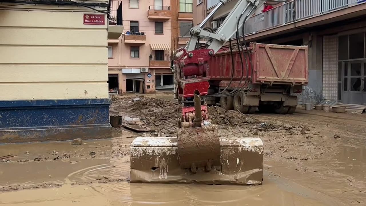 Excavator Operator Uses Refrigerator As Broom During Cleanup Efforts