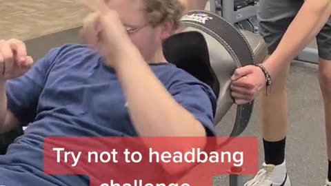 Guy head bangs in gym