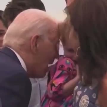 Biden nibbles on terrified child again