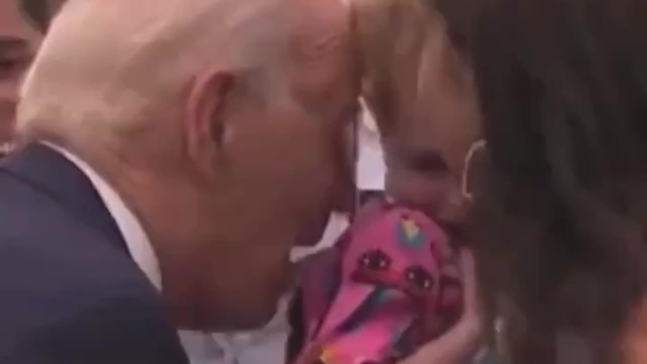 Biden nibbles on terrified child again