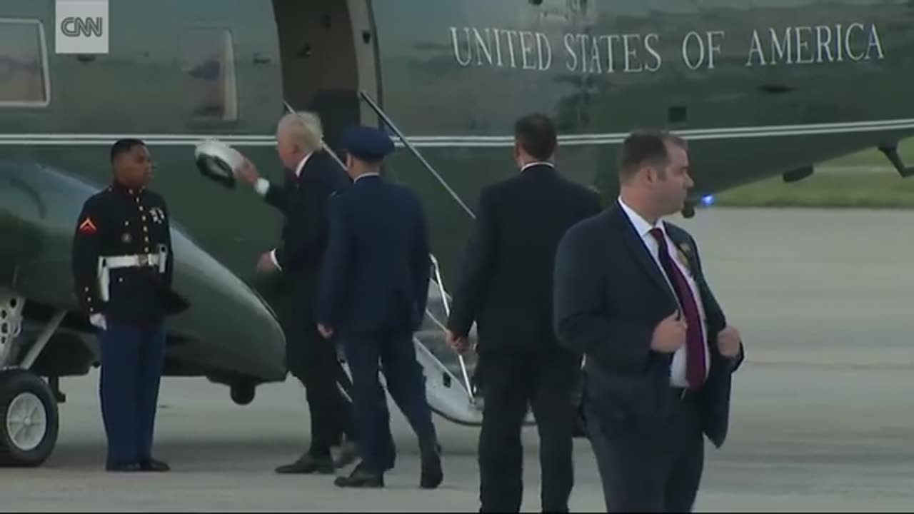 Trump stops to retrieve Marine's hat