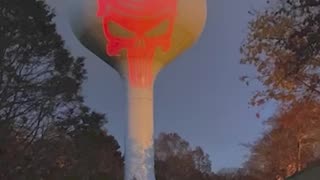 "Punisher" Trump image projected onto water tower