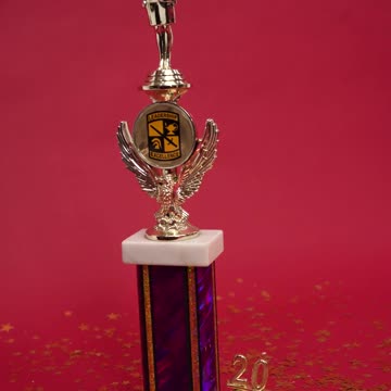 A Gold Trophy and Confetti on the Ground