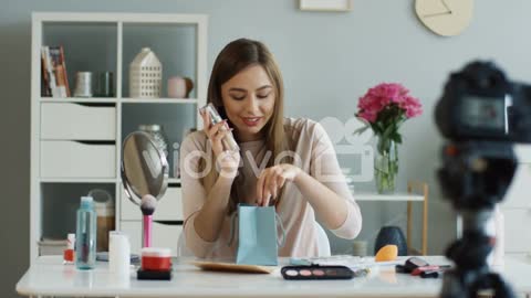 Young Fashion Blogger Recording Video While Talking About Makeup And Cosmetics To Her Followers