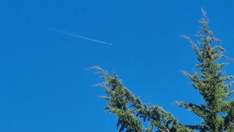 Contrail From An Aircraft Flying Over North Wales.