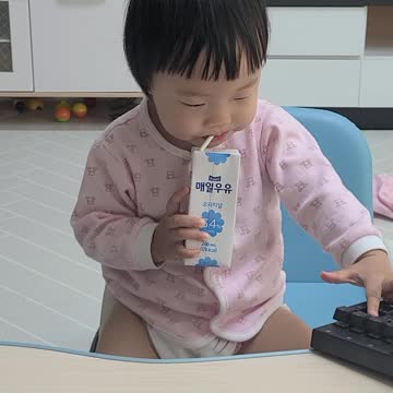Baby drinks milk