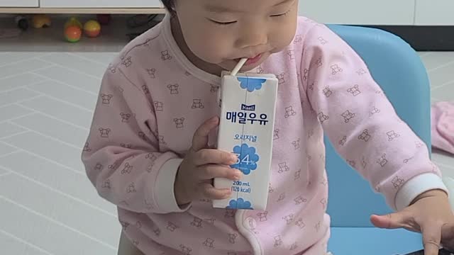 Baby drinks milk