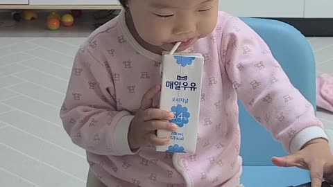 Baby drinks milk