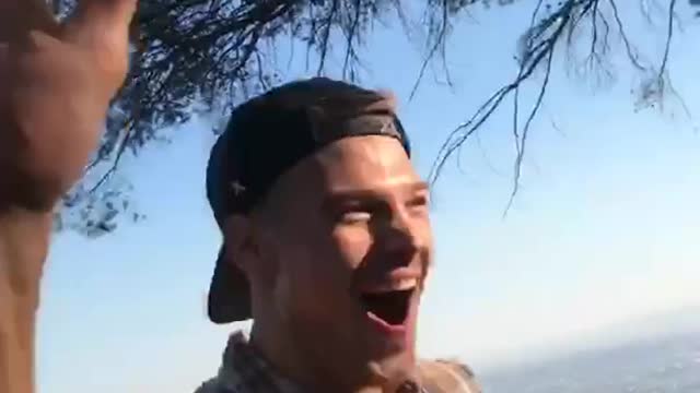 Leafblower blows hat onto other guy's head (careful cursing at end)