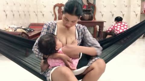 Nice baby breastfeeding milk from mom cute lady