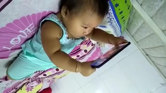 The baby opens the phone himself