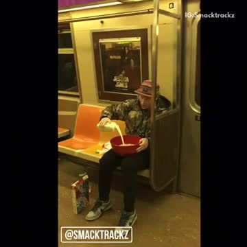 Man eats lucky charms in large red bowl