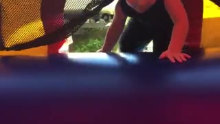 Little boy enters jumper and falls back and outside