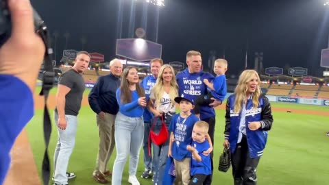 Freddie Freeman catching up with his family on the field after his walk-off grand slam to win Game 1