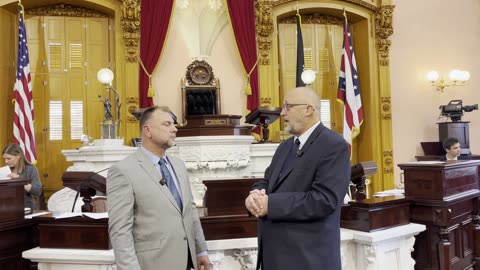 Ohio State Representative Gary Click is talking with Pastor Artur Pawlowski in the Ohio Statehouse