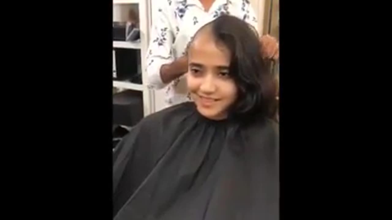 Cute Girl shave her head at man salon