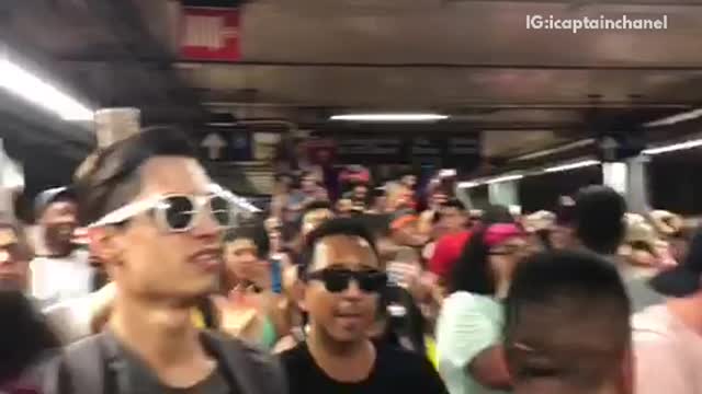 Crowd jumping cheering party underground subway station