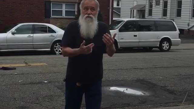 Old man long beard kicking red balloon