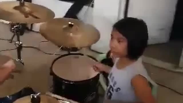 8 Year Old Girl Playing Drums During Choir Practice In Church