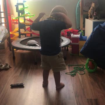 My nephew putting on beads