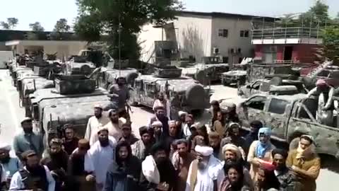 Taliban commander Abdul Hamid Hamasi inspects US-made armored vehicles in Kabul