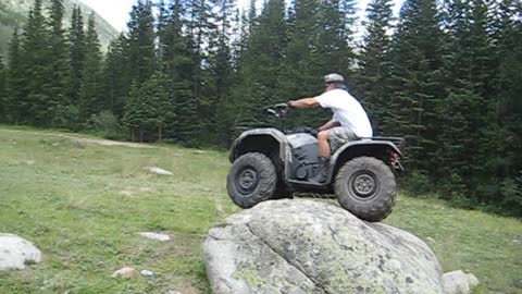 Guy Flips ATV Over Trying To Ride Over Boulder