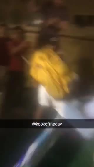 Yellow backpack piggy back surfboard kid falls off friends shoulders