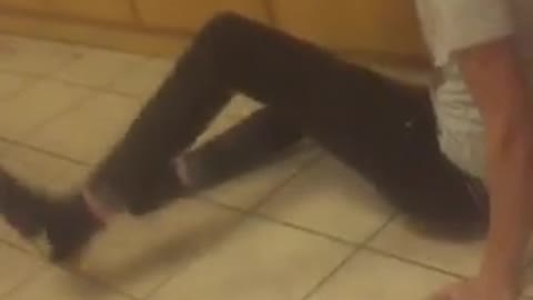 Guy black shirt punches guy white shirt in face