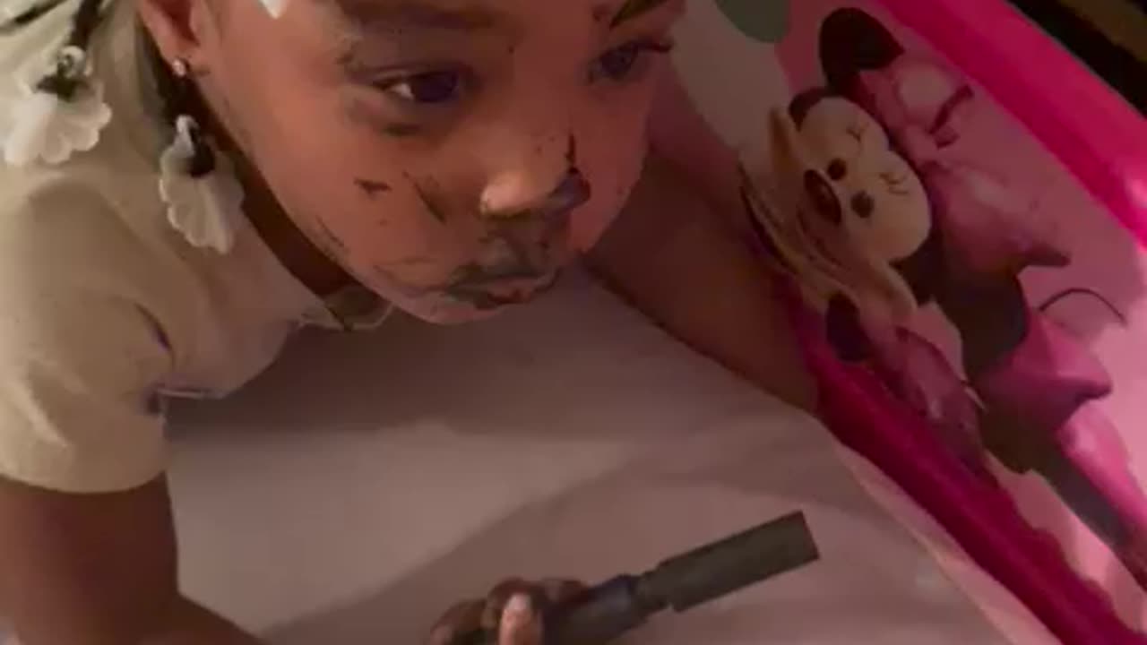 Toddler tries to put on mom make up