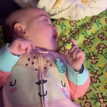 Excited baby watching cartoons