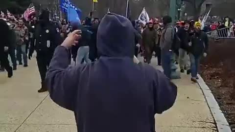 Another instance of police opening gates waving people in to flood Capitol Hill
