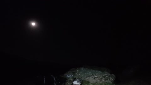 Sorting out lighting and positioning the camera to film at Saddle Tor. For a night vlog.