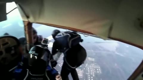 Two planes crash in the air while skydiving