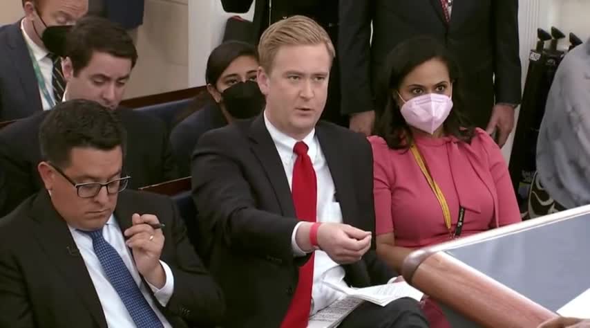 Felow Reporter Trying not to Burst out in Laughter as Doocy Grills Karine