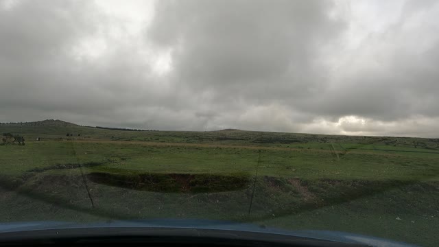 Mino vlog in car overlooking belever tor