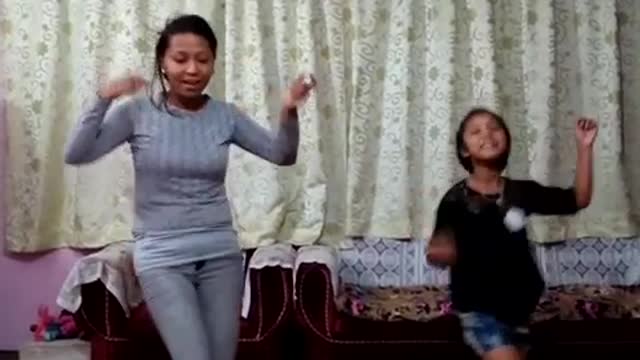 daughter is imitating the dance steps of mom