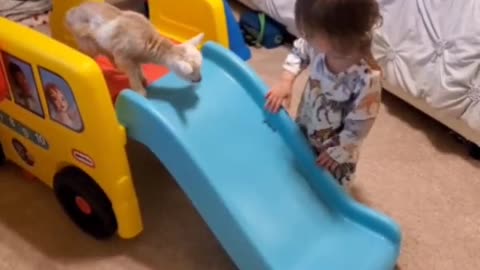 Kid teaching kid how to slide...👶🛝🐐😍