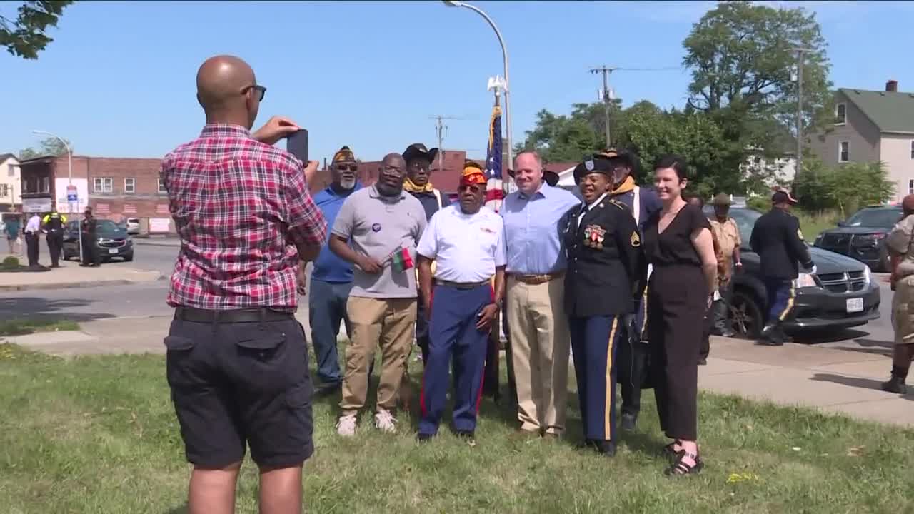 Several dozen people gathered for a parade to honor African American Veterans