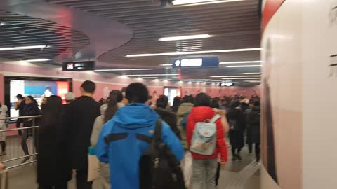 There are a lot of people on the Beijing subway