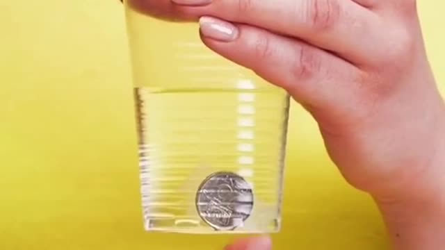 DIY coin through water cup magic trick