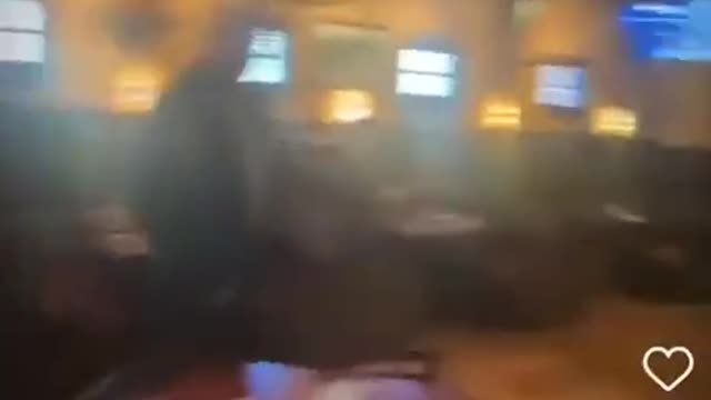 The governor of Nevada(Steve Sisolak) bumps into a fan at a bar