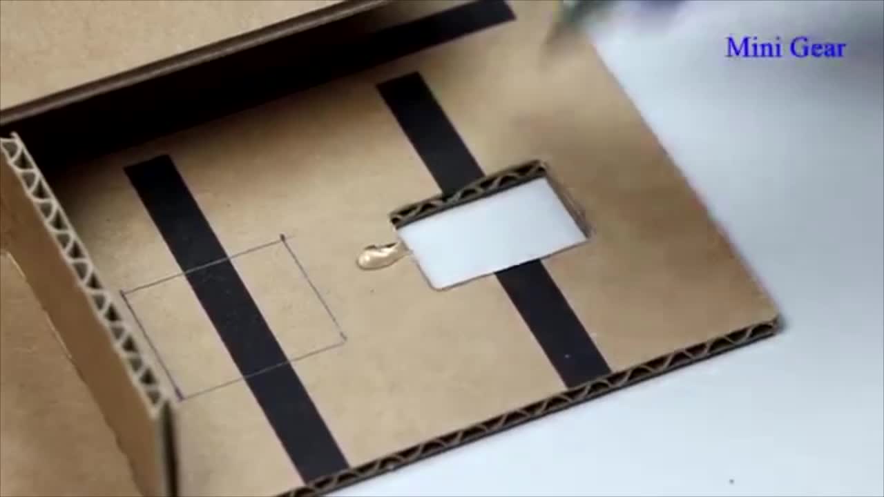 Cut Two Small Squares On The Cardboard