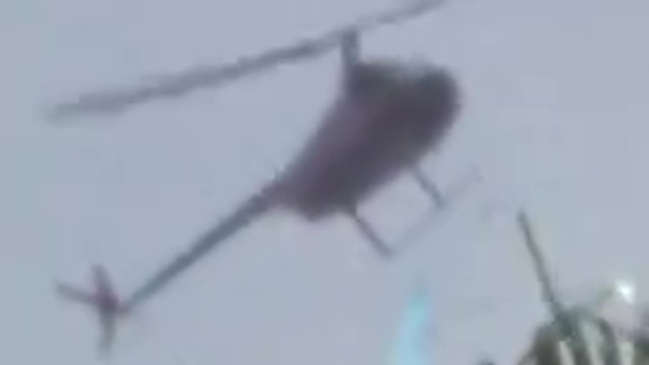 A woman in Florida captured footage of a helicopter spraying a mysterious blue chemical?!?