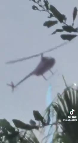 A woman in Florida captured footage of a helicopter spraying a mysterious blue chemical?!?