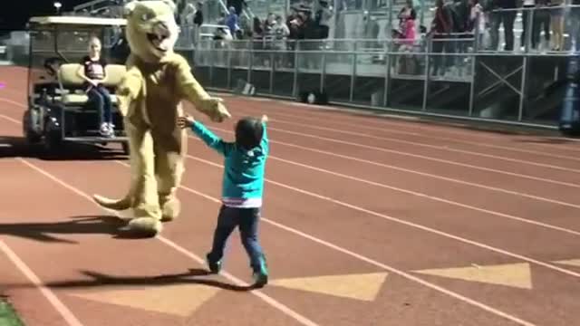 Toddler Shows Off Dance Moves In Front Of A Crowded Stadium