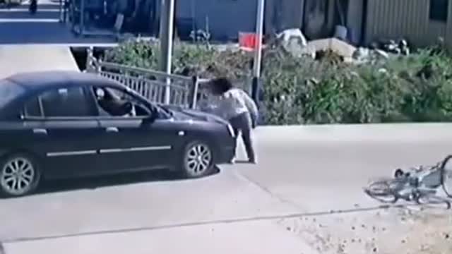 Girl hit by car on bike miraculously survives and continues to skate on her phone